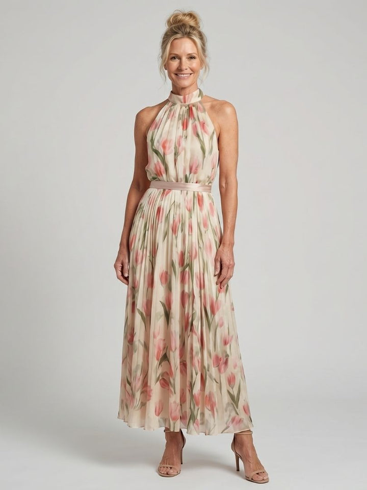 Cream halter neck floral midi dress, perfect for chic summer vacation fashion.