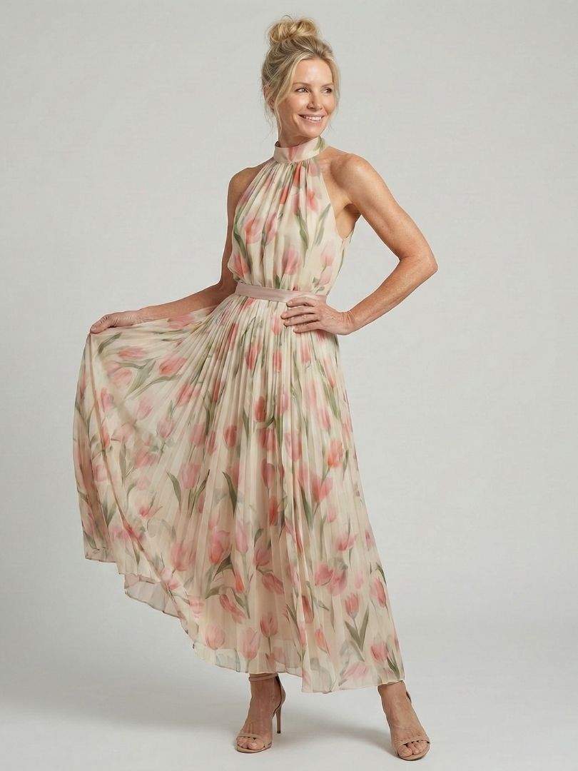 Vibrant yellow halter neck summer dress with a floral pattern, flowy & comfortable.