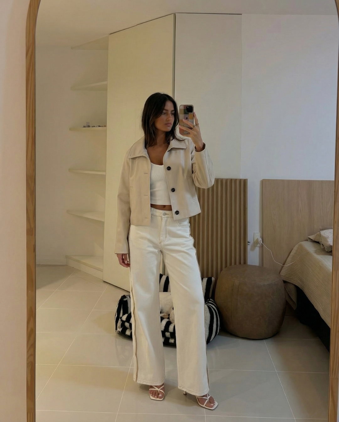 Chic cream cropped jacket for women, featuring a relaxed fit & minimalist style for modern transitional wear.