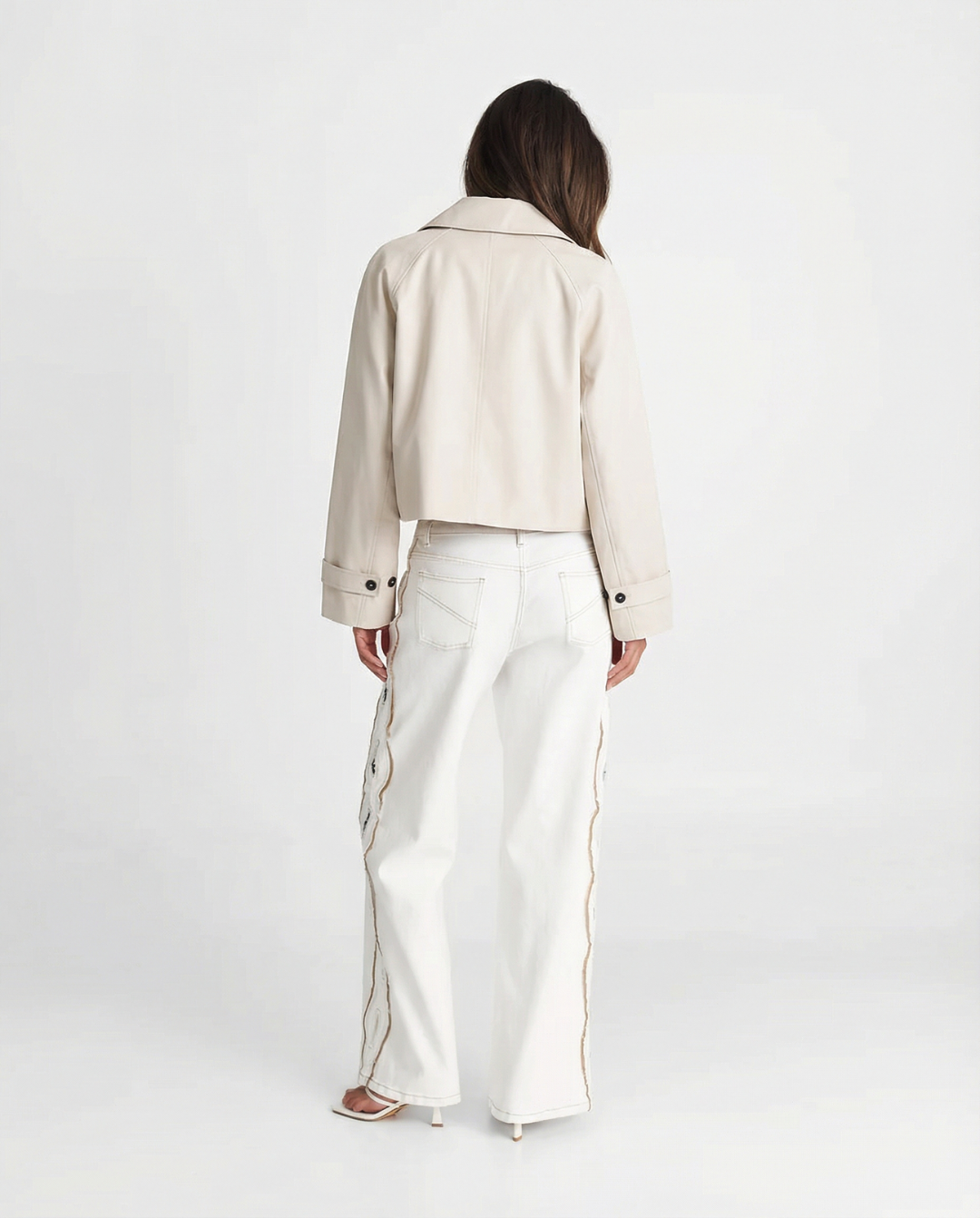 Modern cream cropped jacket for women, short and relaxed fit, embodying effortless minimalist style.