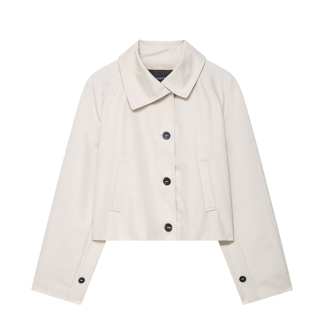 Versatile cream women's cropped jacket. Relaxed fit for spring & autumn, chic modern outerwear.