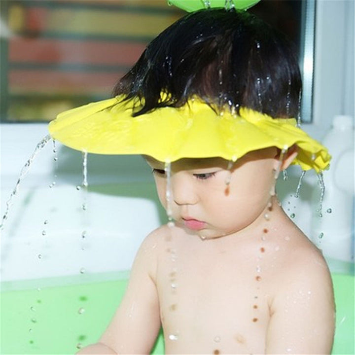 Waterproof baby bath shampoo hat with ear protection, ideal for toddler bath time fun.