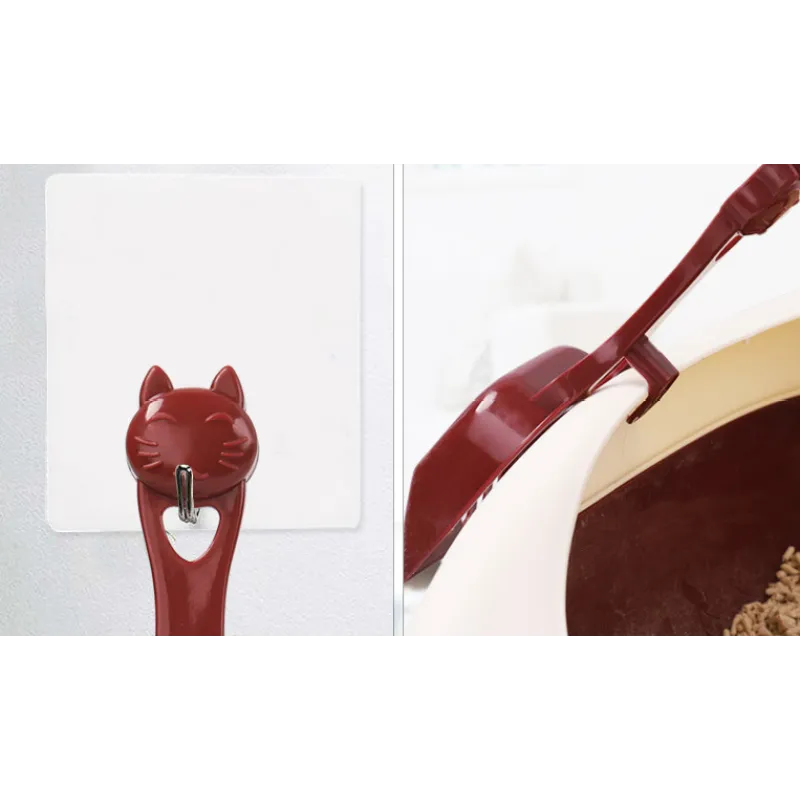 Stylish cat head litter scoop, a must-have cat accessory for efficient pet care & litter box cleaning.