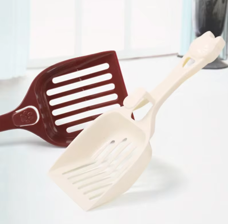 Unique cat head design litter scoop, making litter box cleaning easier & more stylish for your pet.