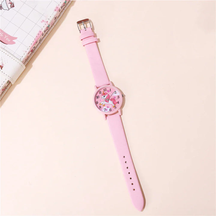 Enchanting unicorn cartoon watch for girls, featuring a comfortable and durable pink PU leather strap.
