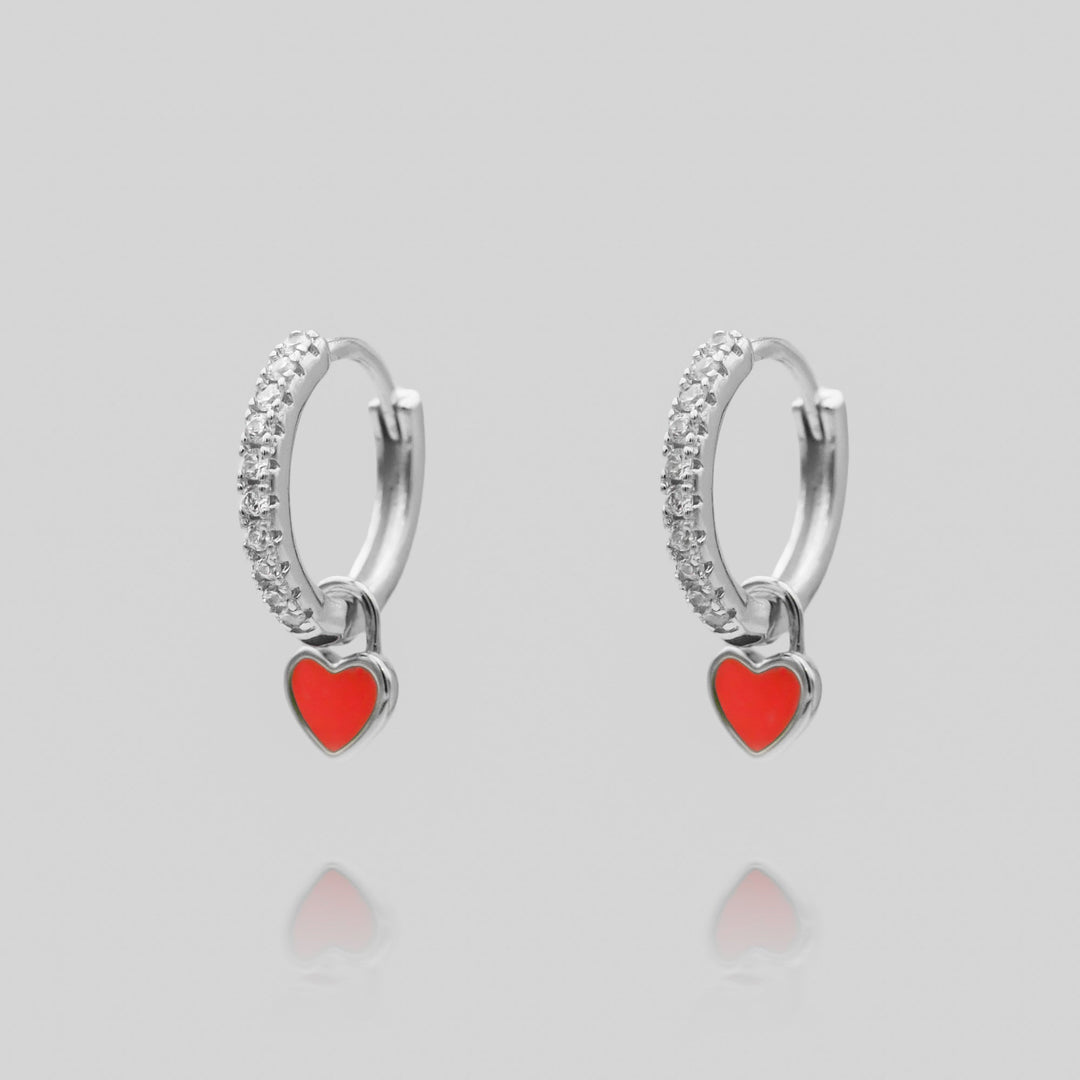 Exquisite silver plated dainty heart huggie hoop earrings, chic women's accessory.
