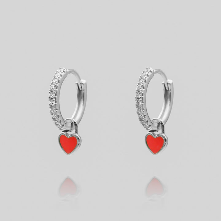 Exquisite silver plated dainty heart huggie hoop earrings, chic women's accessory.