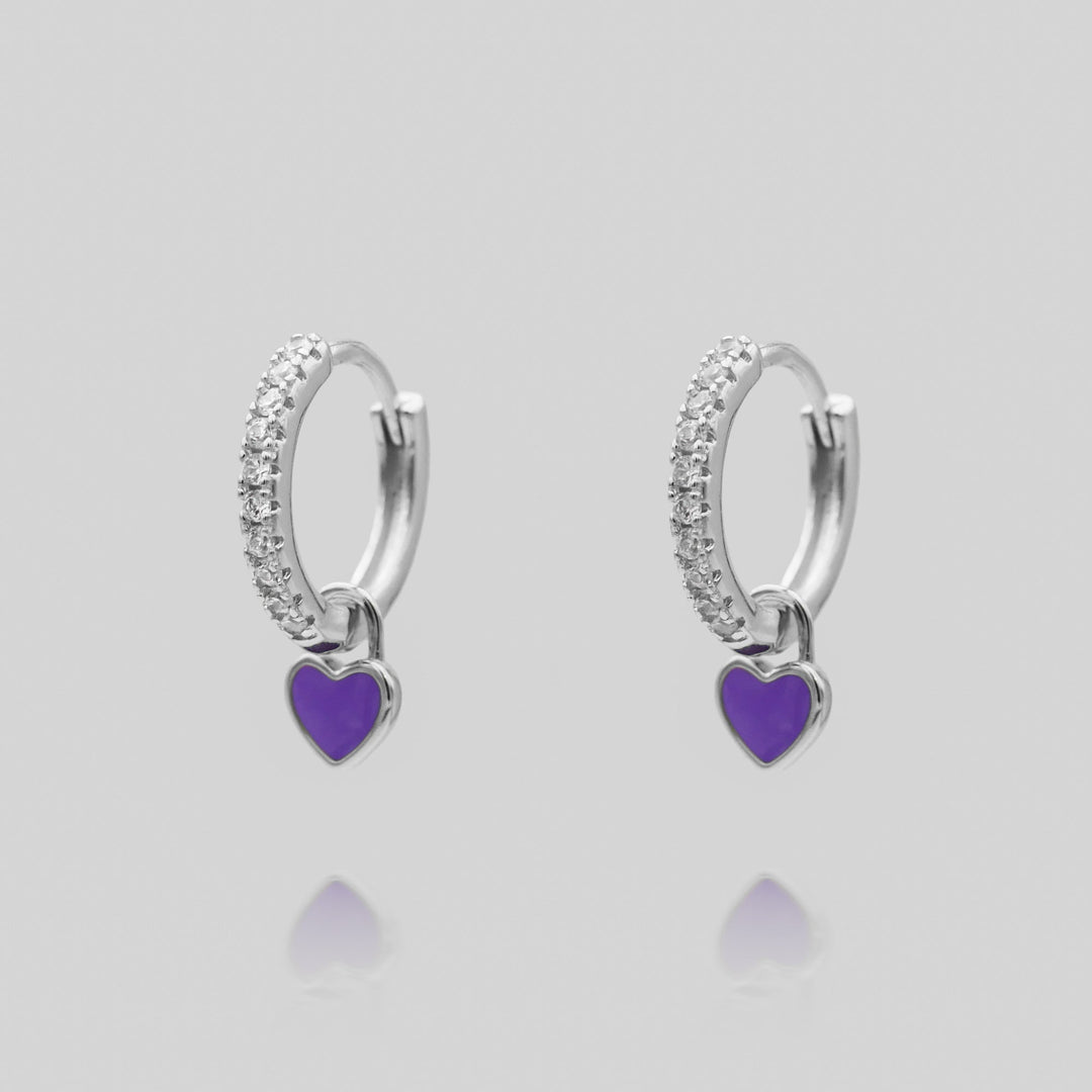 Dainty heart huggie hoop earrings, a subtle yet stylish jewelry piece for women.