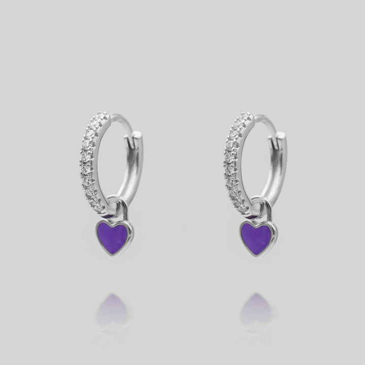 Dainty heart huggie hoop earrings, a subtle yet stylish jewelry piece for women.