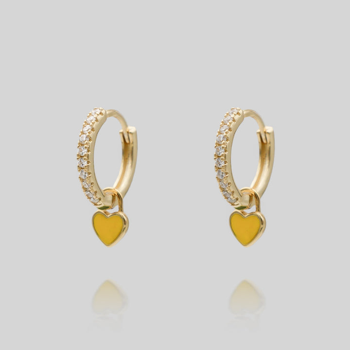 A pair of elegant silver plated dainty heart huggie hoop earrings, charming women's gift.