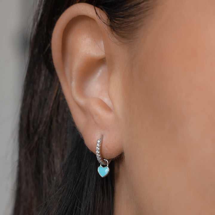 Sparkling silver plated dainty heart huggie hoop earrings, perfect women's gift jewelry.