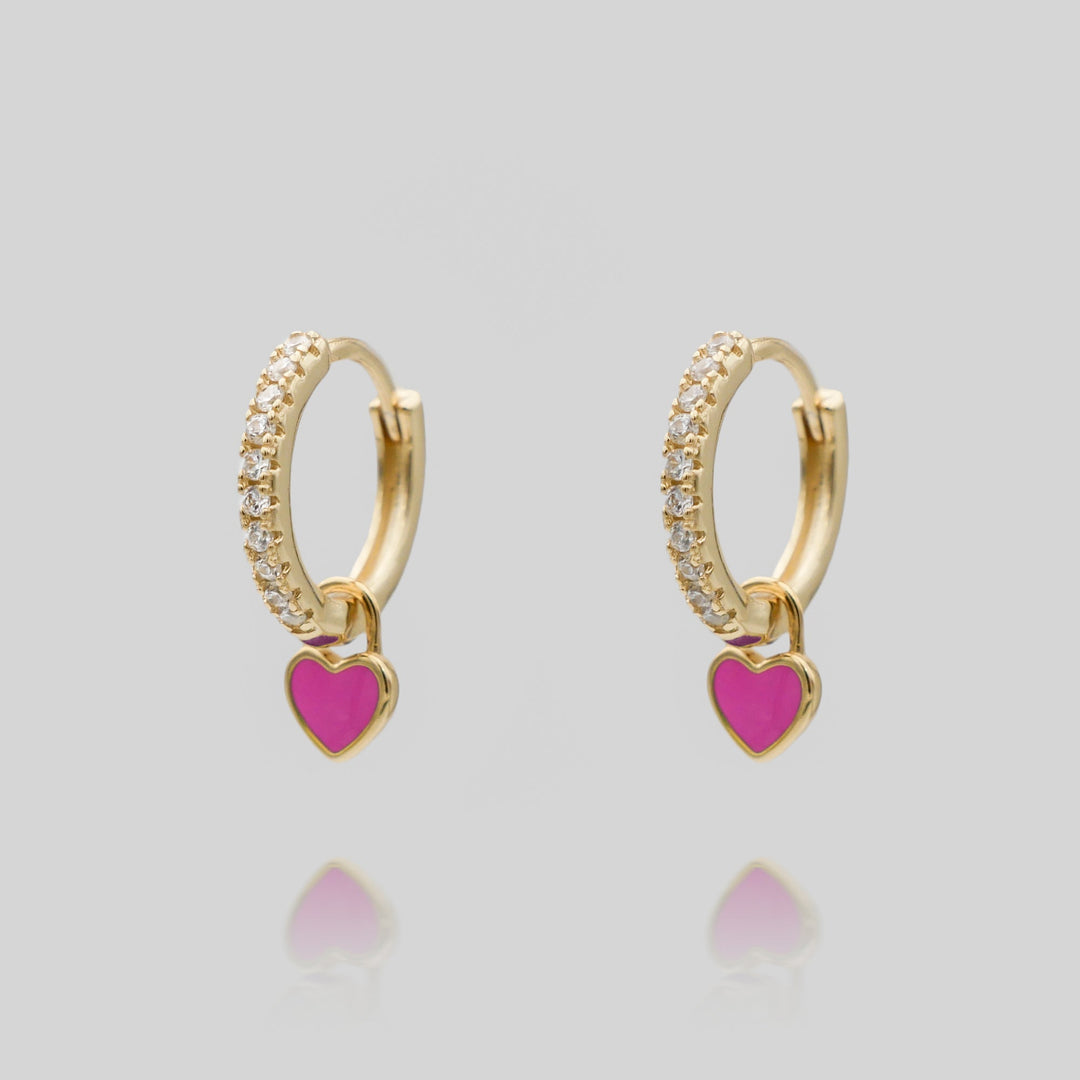 Silver plated dainty heart huggie hoop earrings, a charming accessory for women.