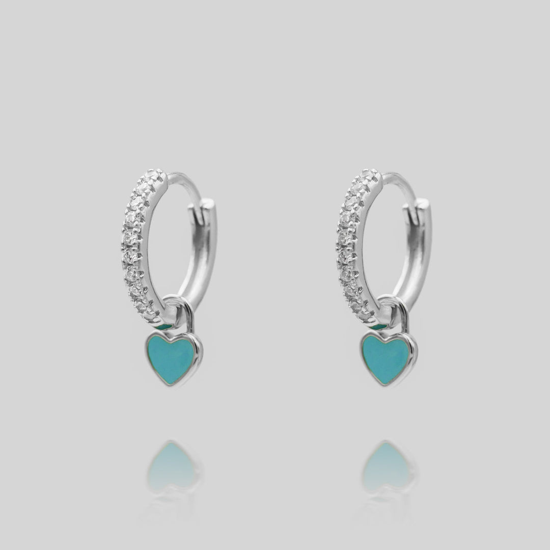 Assorted dainty heart huggie hoop earrings in gold and silver, cute women's gift.