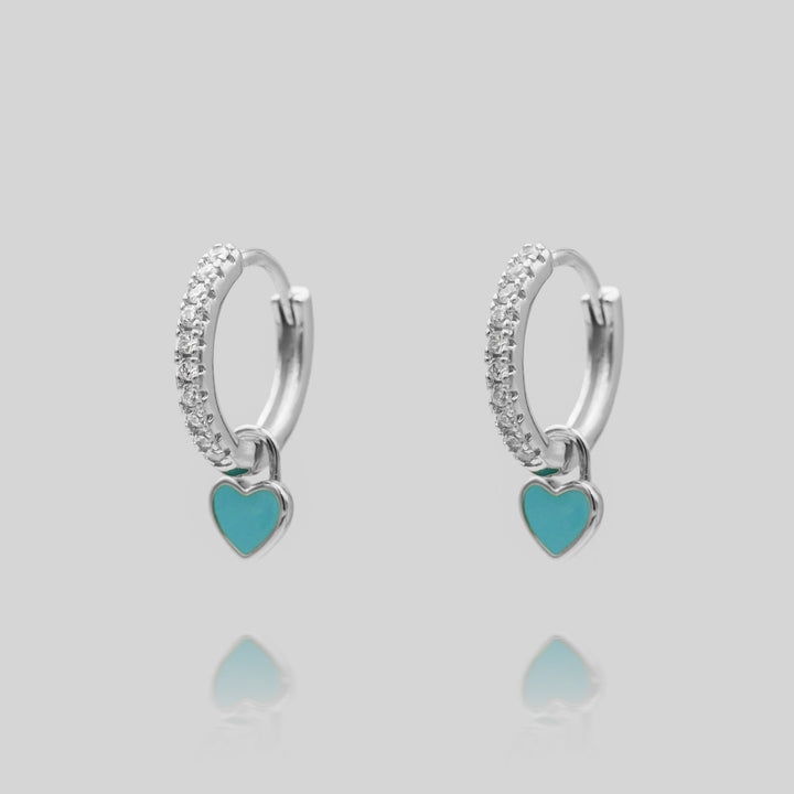 Assorted dainty heart huggie hoop earrings in gold and silver, cute women's gift.