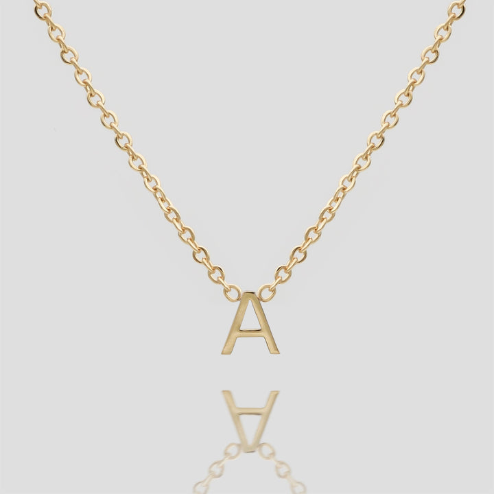 Dainty personalized initial necklace in gold for women.