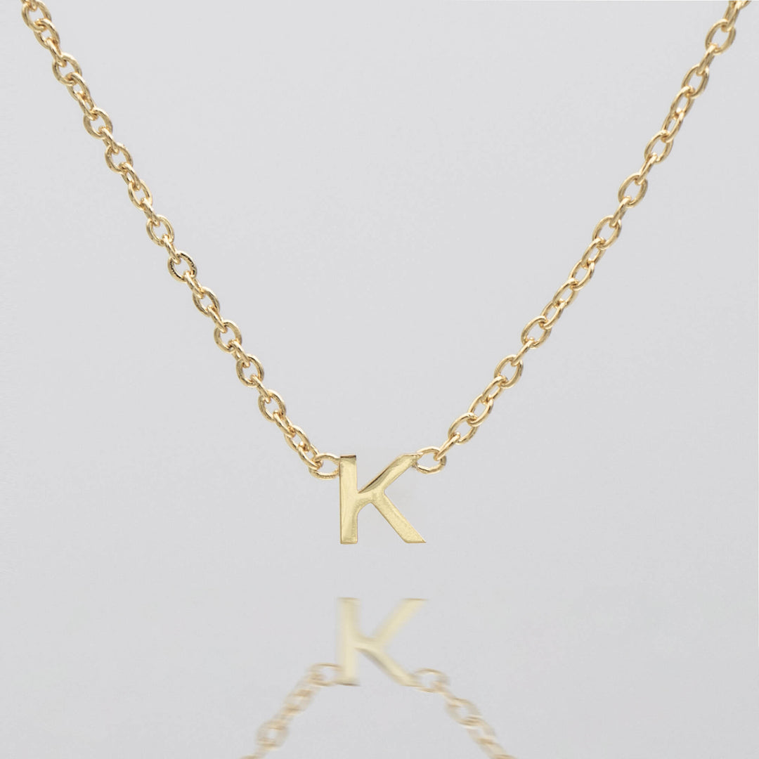 Personalized silver initial necklace, delicate pendant gift.