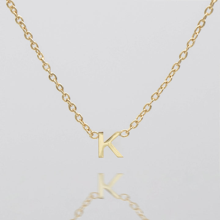 Personalized silver initial necklace, delicate pendant gift.