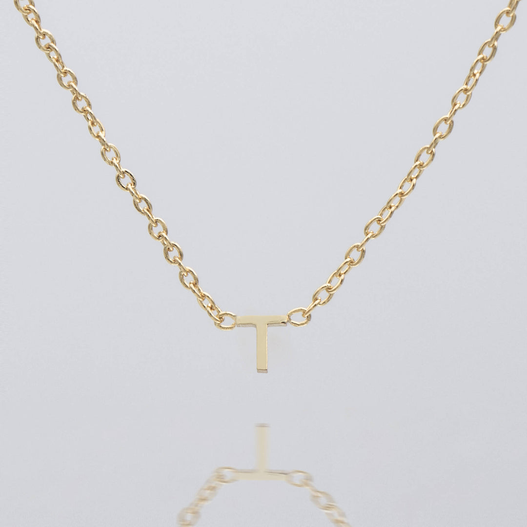 Personalized dainty silver initial necklace, elegant pendant.
