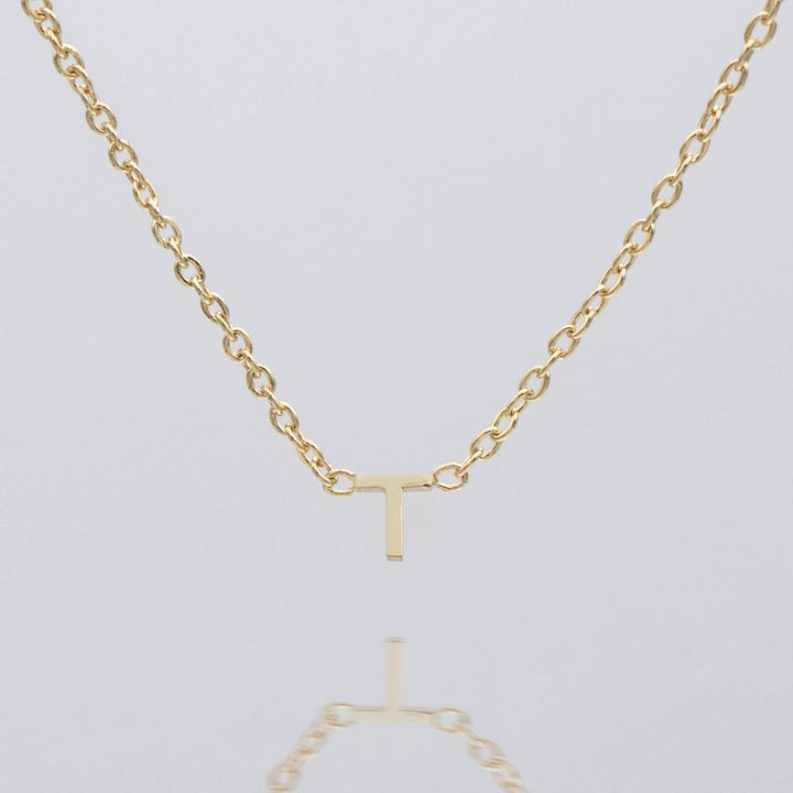Personalized dainty silver initial necklace, elegant pendant.