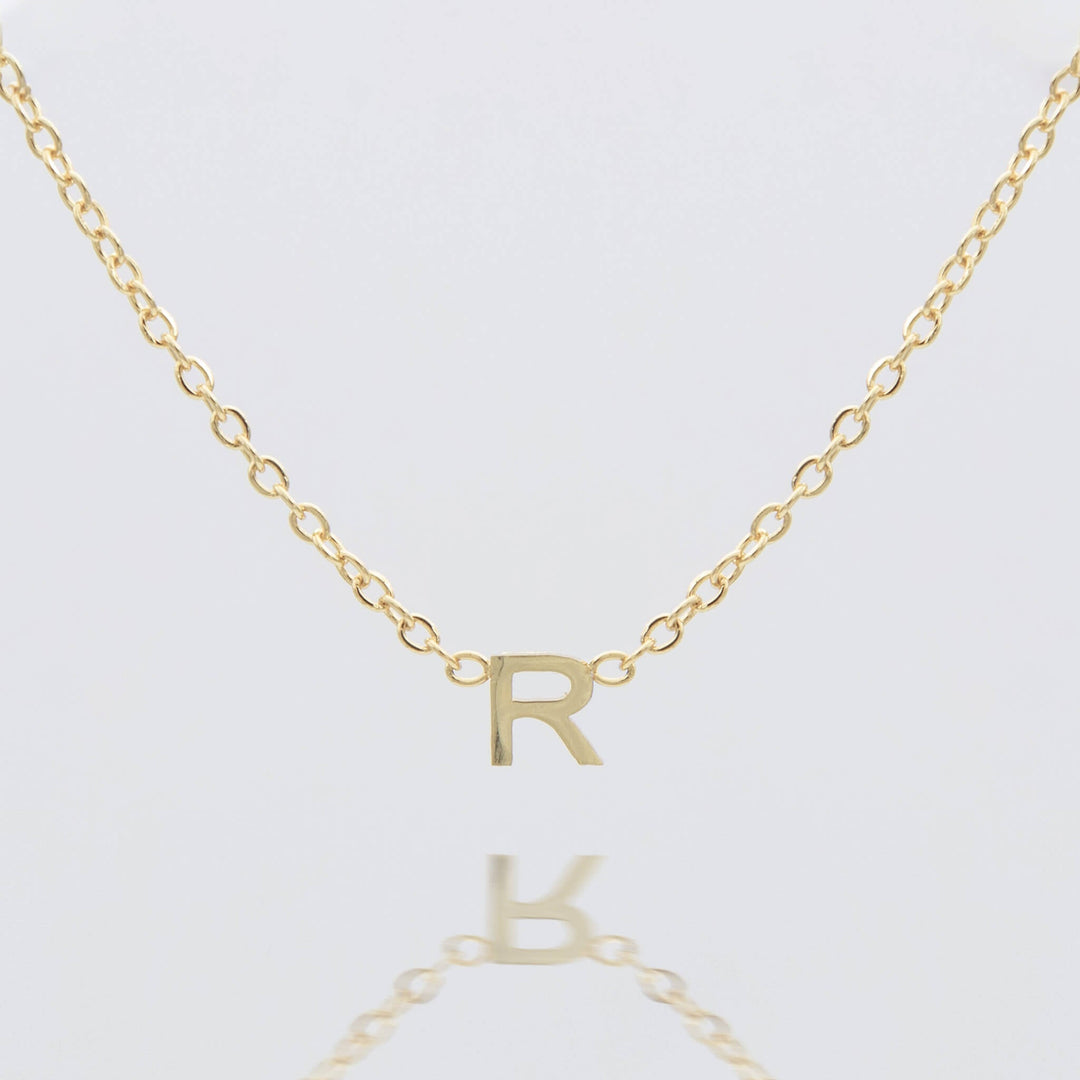 Women's personalized gold initial necklace, delicate jewelry gift.