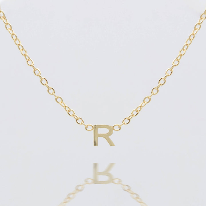 Women's personalized gold initial necklace, delicate jewelry gift.