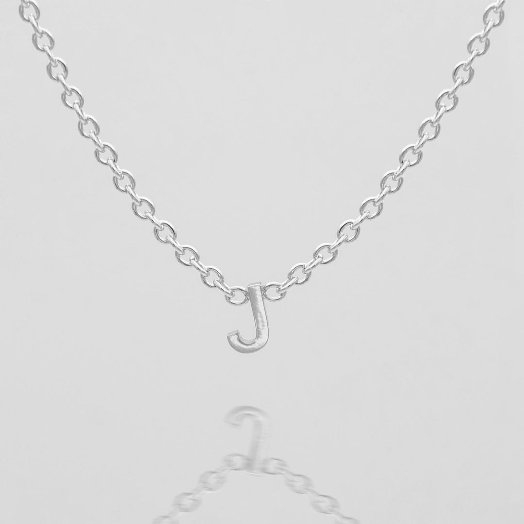 Women's dainty personalized gold letter necklace.