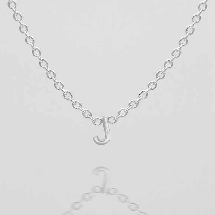 Women's dainty personalized gold letter necklace.