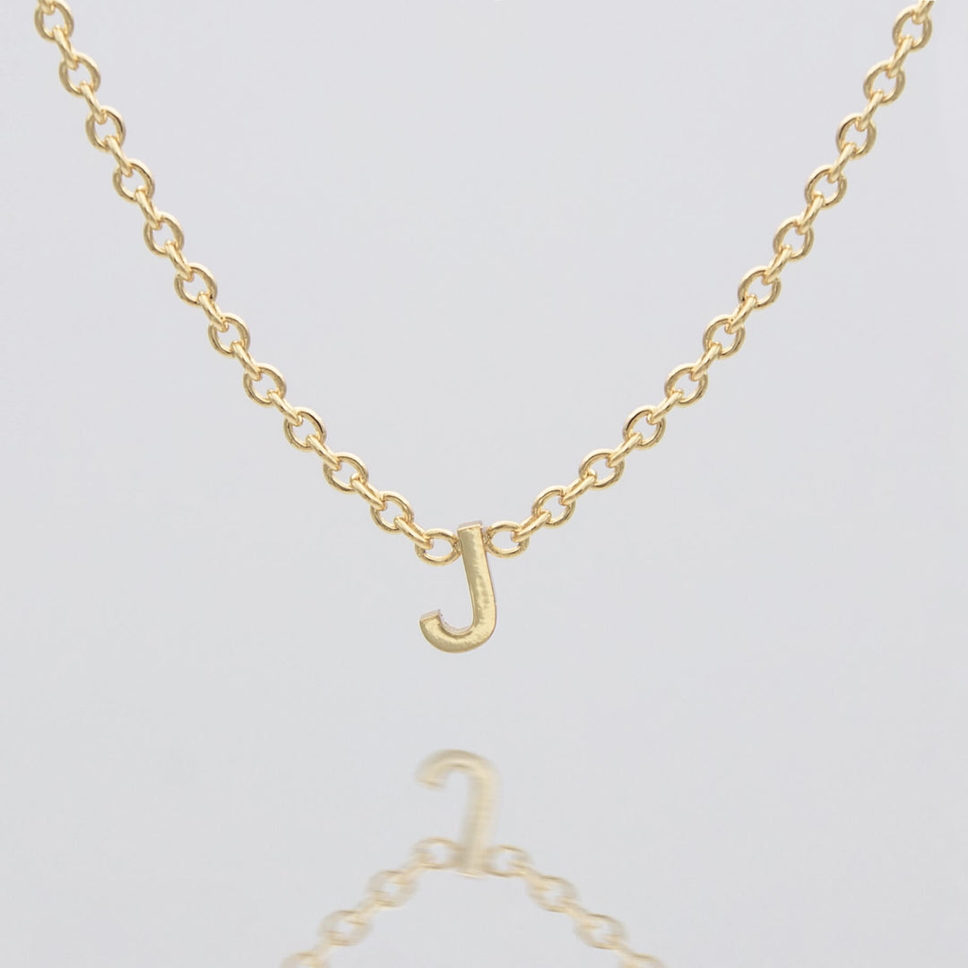 Women's personalized gold dainty initial necklace.