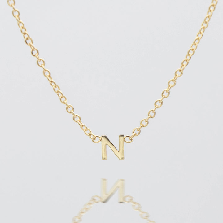 Silver custom letter dainty pendant necklace.