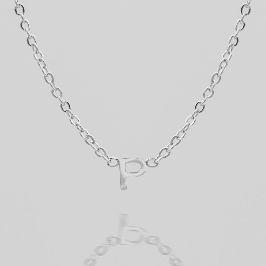 Custom dainty gold initial necklace, perfect for gifting.