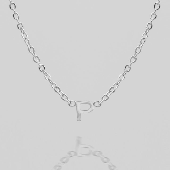 Custom dainty gold initial necklace, perfect for gifting.