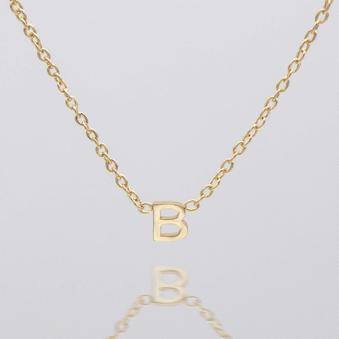 Women's personalized letter necklace, delicate silver pendant.