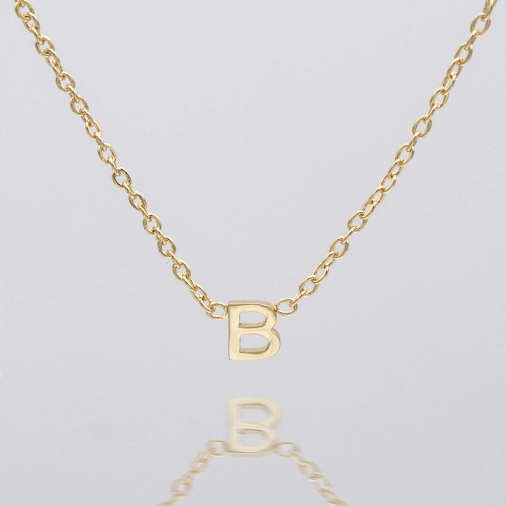 Women's personalized letter necklace, delicate silver pendant.