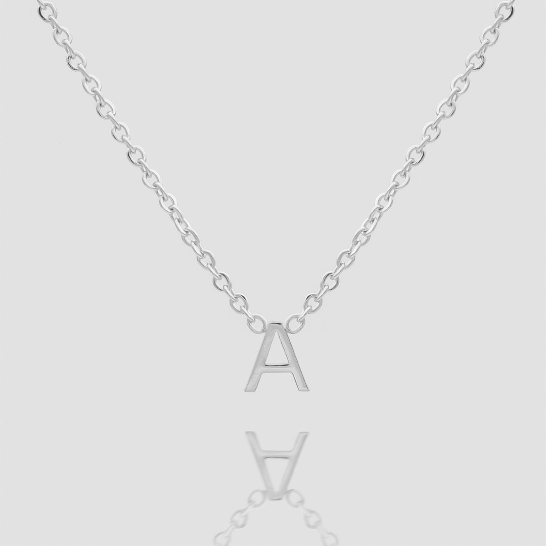 Women's silver custom initial necklace, delicate and personalized.