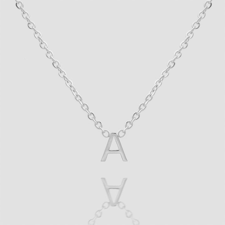 Women's silver custom initial necklace, delicate and personalized.