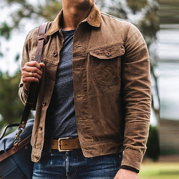 Stylish men's dark brown vintage utility jacket featuring multiple functional pockets. Perfect for spring & fall.