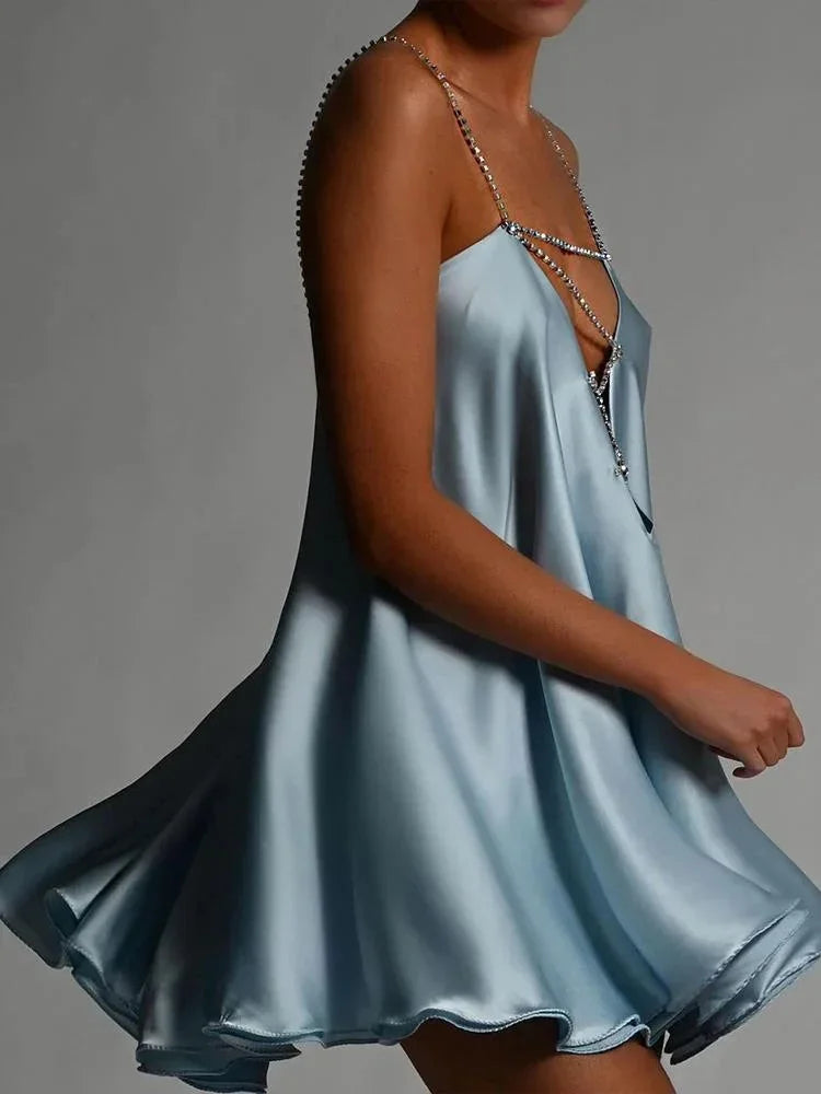Stunning backless women's mini dress, sleeveless and dazzling, designed for elegant evening parties & events.