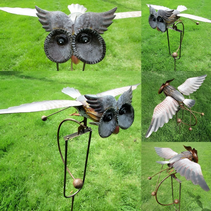 Intricate metal bird wind spinner, a beautiful garden decor and yard sculpture enhancing outdoor aesthetic.
