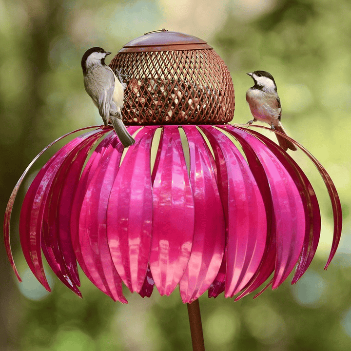 Charming pink metal flower bird feeder, a beautiful garden decor accessory.
