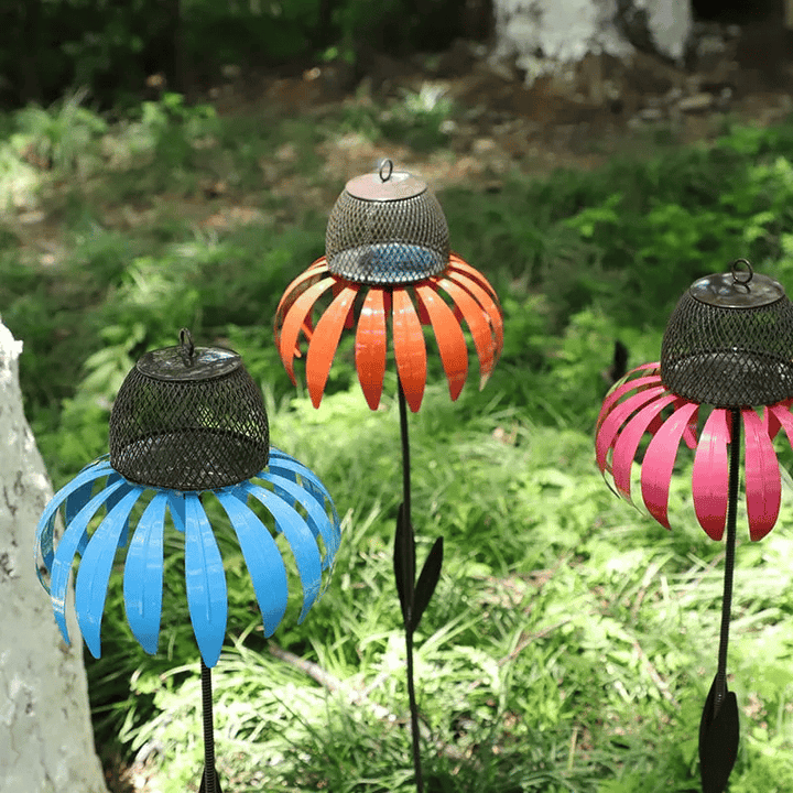 Orange metal flower bird feeder, a durable and decorative garden ornament.