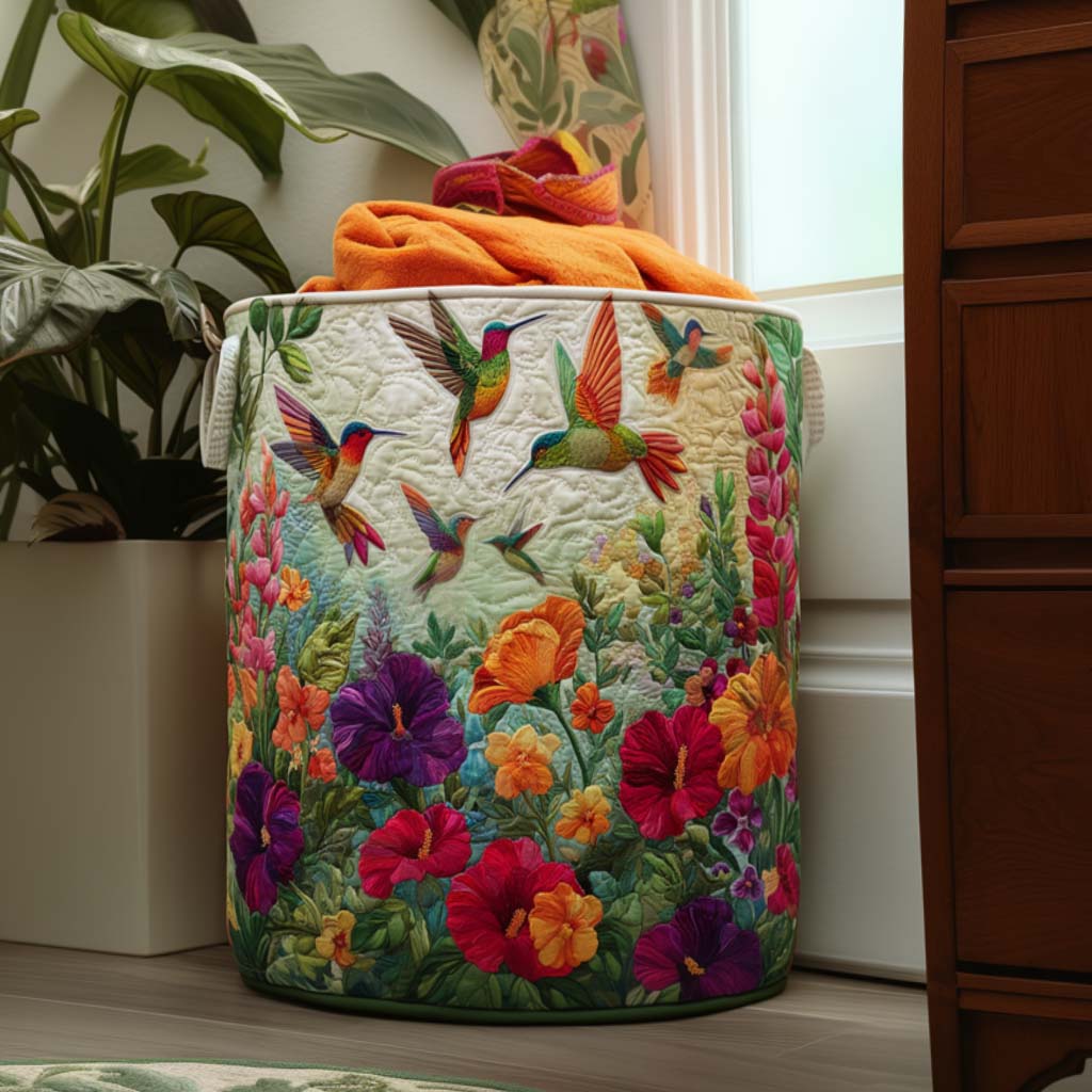 Decorative quilted laundry hamper with Flutter & Bloom floral design. Fabric storage basket for home organization.