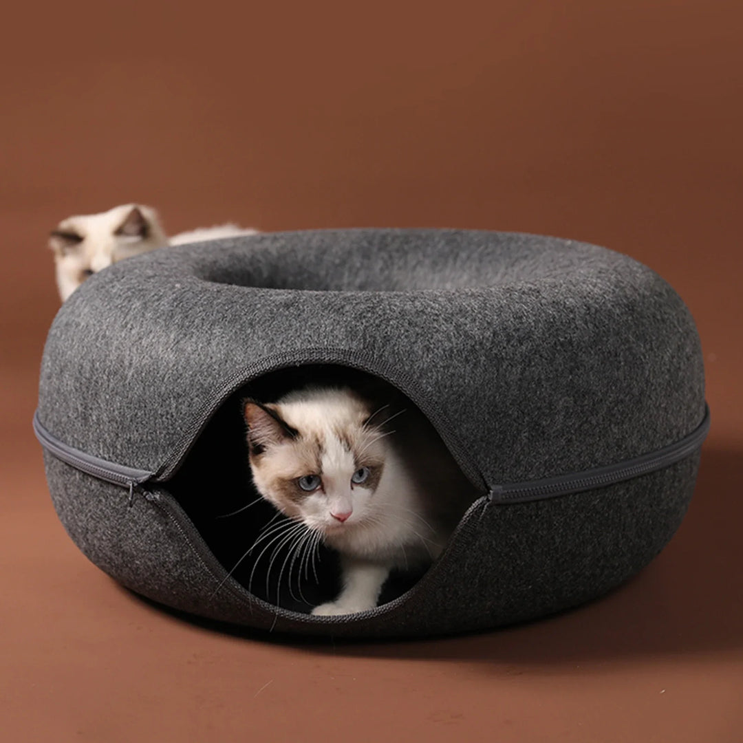 Donut cat cave bed in dark grey felt, offering a cozy pet hideaway.