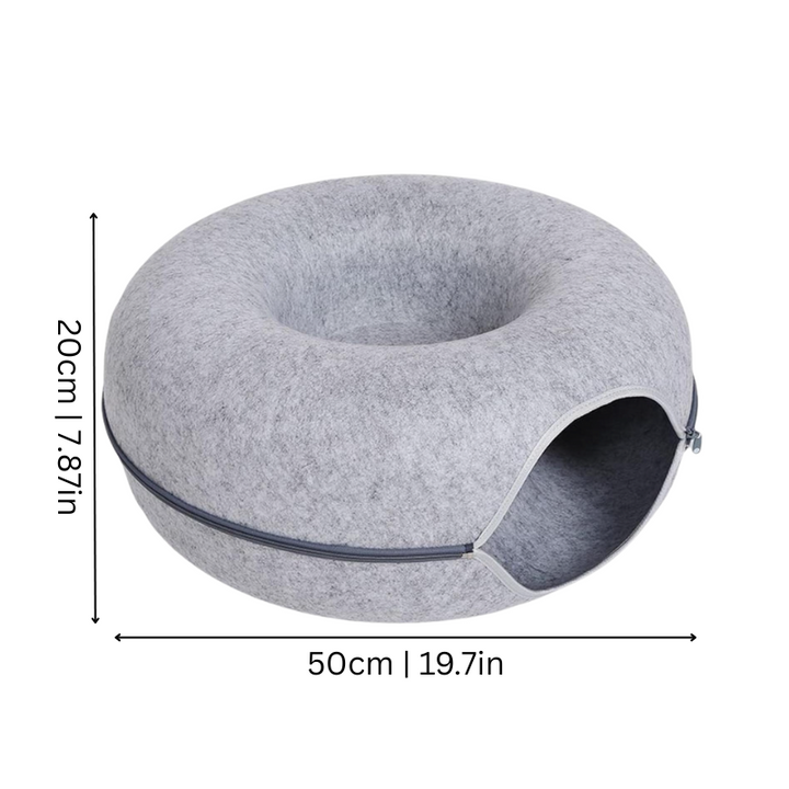 Plush donut cat bed providing a comfortable and secure cat cave.