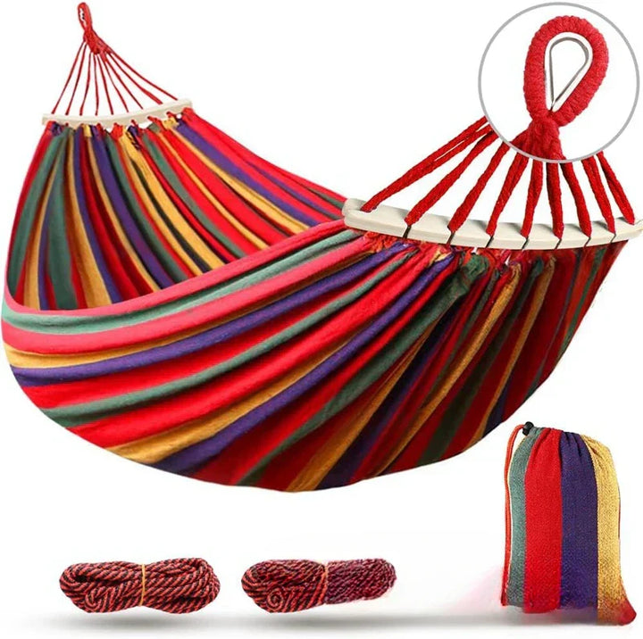 Enhance your patio with this blue double canvas hammock and spreader bars.