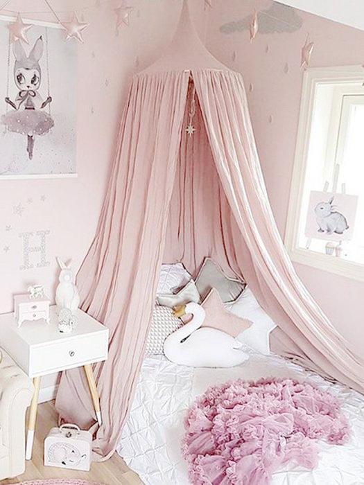 Dreamy kids' magical nursery bed canopy, perfect for creating a cozy and enchanting play tent in a child's room.