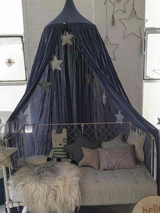 Magical kids' play tent canopy for a nursery, creating a cozy space, dreamy room decor and imaginative play area.