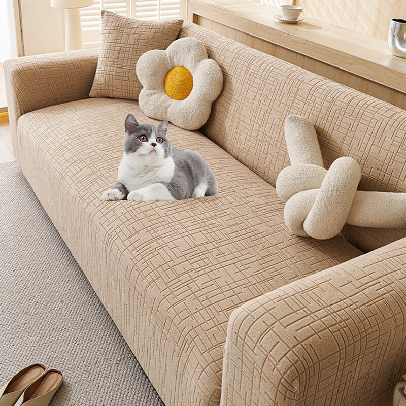 Anti-scratch jacquard pet sofa protector in beige, keeping furniture safe from pet claws & wear.