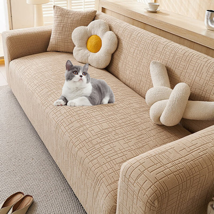 Anti-scratch jacquard pet sofa protector in beige, keeping furniture safe from pet claws & wear.