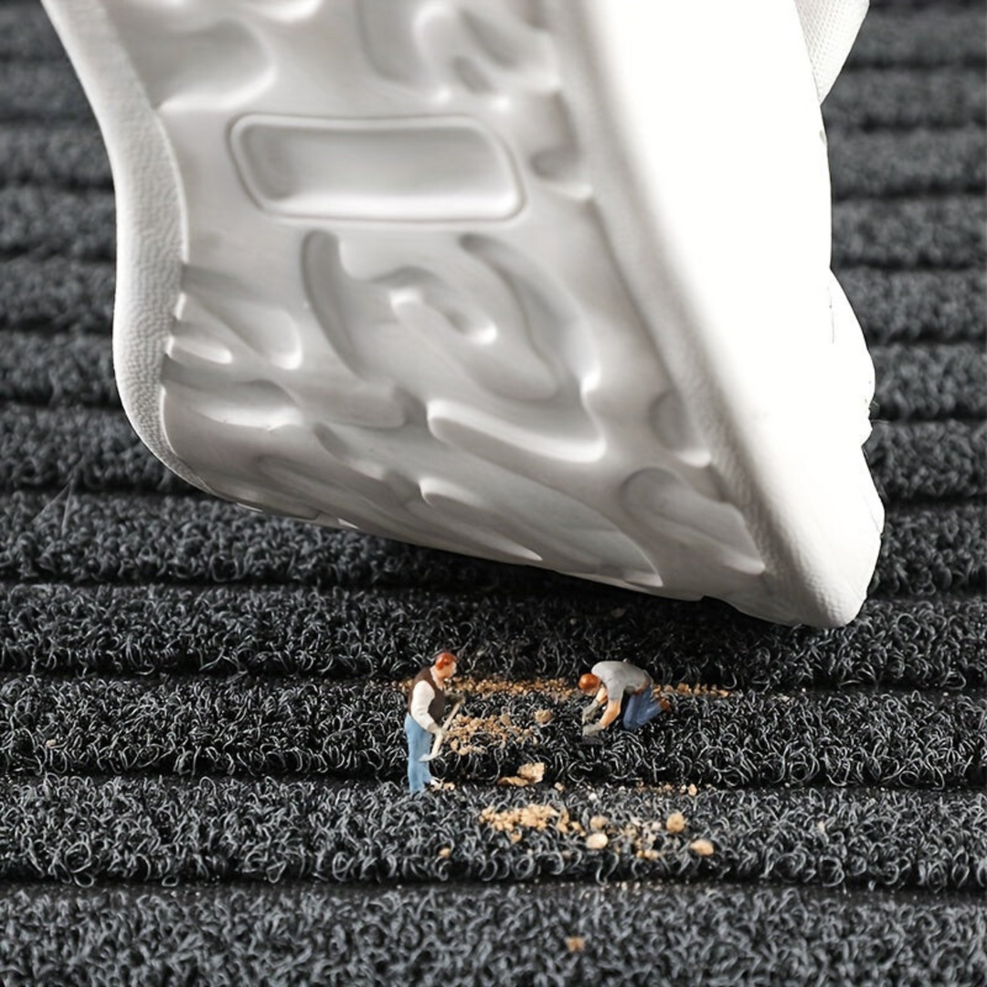 Gray ribbed non-slip outdoor entrance mat. Weatherproof, washable doormat for all-season entryway use.