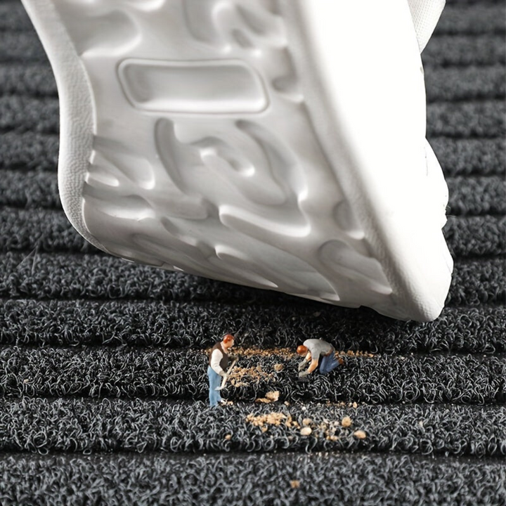 Gray ribbed non-slip outdoor entrance mat. Weatherproof, washable doormat for all-season entryway use.